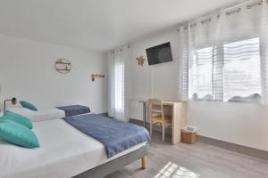 Postel nebo postele na pokoji v ubytování Hotel du Cap