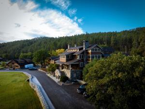 an aerial view of a large house in the mountains at Creekside Lodge at Custer State Park Resort in Custer