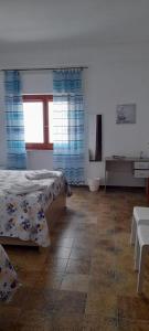Postel nebo postele na pokoji v ubytování B&B Don Orlando