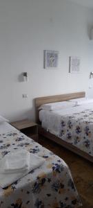 Postel nebo postele na pokoji v ubytování B&B Don Orlando
