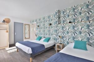 Postel nebo postele na pokoji v ubytování Hotel du Cap