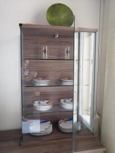 a glass display case with plates on it at Piso en San Fernando (Cádiz) in San Fernando