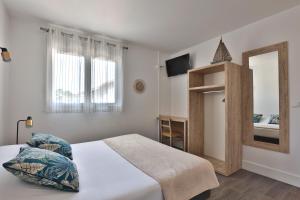 Postel nebo postele na pokoji v ubytování Hotel du Cap