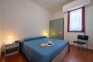 Letto o letti in una camera di Hotel Mira