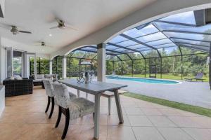 The swimming pool at or close to Luxury home, close to the beach and heated pool.