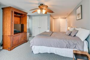 a bedroom with a bed and a ceiling fan at Spacious Canandaigua Lake House with Dock and Kayak! in Canandaigua