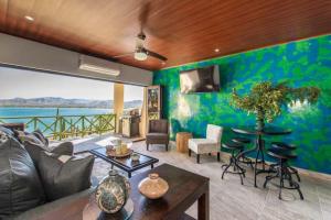 a living room with a couch and a table at Central located in Flamingo, Condo with gorgeous views - Flamingo Marina Resort in Playa Flamingo