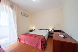 Letto o letti in una camera di Hotel Mira