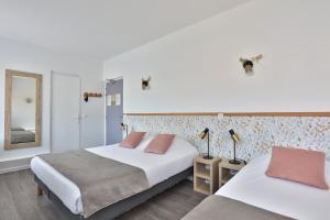 Postel nebo postele na pokoji v ubytování Hotel du Cap