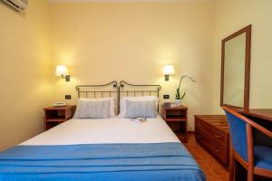 Letto o letti in una camera di Hotel Mira