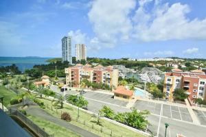 a view of a street in a city with buildings at 506 Ocean & Marina Views 3 Bedroom 2 Bathroom Lux in Fajardo