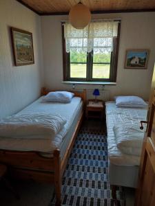 Postel nebo postele na pokoji v ubytování Ljusadals Pärla + 5 fotografií