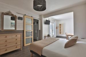 Postel nebo postele na pokoji v ubytování Hotel du Cap