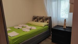 Posteľ alebo postele v izbe v ubytovaní Apartment KRISTINA