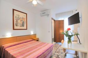 Voodi või voodid majutusasutuse Hotel Itta toas