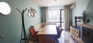 a dining room with a table and chairs and a fireplace at Dream Villa in Imperial Heights Villas in Sunny Beach