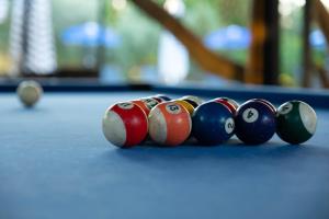a group of billiard balls on a pool table at Kibele Hotel in Oludeniz