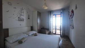 Morska Vila Apartment tesisinde bir odada yatak veya yataklar