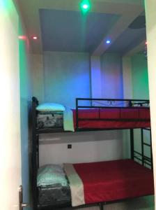 two bunk beds in a room with a rainbow at 100m² avec parking gratuit proche de la plage in Mohammedia