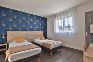 Postel nebo postele na pokoji v ubytování Hotel du Cap