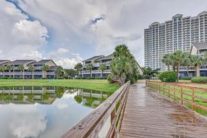 a bridge over a body of water with condos at Stewart House in the Beautiful SeaScape Resort in Destin