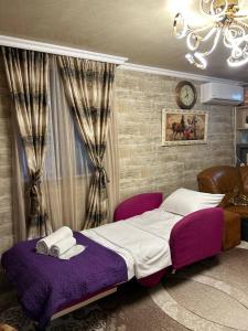 Postel nebo postele na pokoji v ubytování Niluxe Apartment Kutaisi