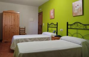 Postel nebo postele na pokoji v ubytování Hotel Condado de Miranda
