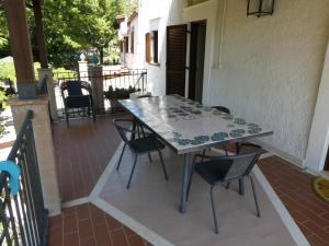 a table and chairs sitting on a patio at Casa Barone, Castiglione a Casauria (Pescara) in Castiglione a Casauria