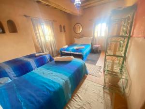 Postel nebo postele na pokoji v ubytování Riad Dar Barbara