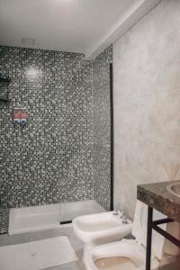 Ett badrum på Distrito A FMA-Coliving