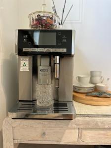 a coffee maker sitting on top of a table at Apartamenty Rajcza in Rajcza