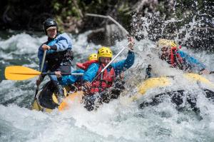 a group of people rafting in a river at Hotel Florido in Sort