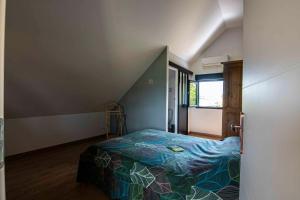 Katil atau katil-katil dalam bilik di Villa indépendante gîte Mas fond des Prés