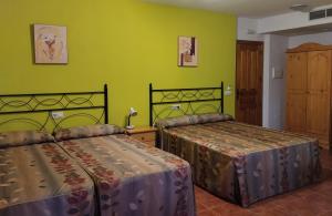 Postel nebo postele na pokoji v ubytování Hotel Condado de Miranda
