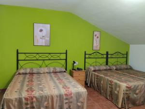 Postel nebo postele na pokoji v ubytování Hotel Condado de Miranda