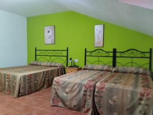 Postel nebo postele na pokoji v ubytování Hotel Condado de Miranda
