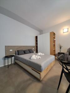 a bedroom with a large bed in a room at Porta San Paolo House in Castelbuono