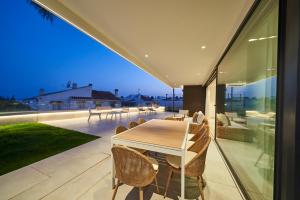 a dining table on the balcony of a house at Sea Gardens Villa in Nerja