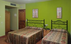 Postel nebo postele na pokoji v ubytování Hotel Condado de Miranda