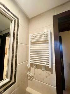 a bathroom with a window and a mirror at Dar Marrakech in Marrakech