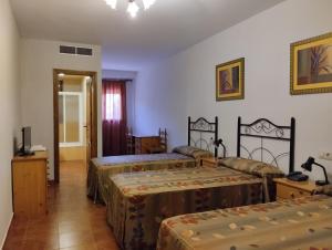 Postel nebo postele na pokoji v ubytování Hotel Condado de Miranda