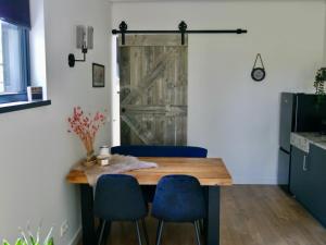 TV a/nebo společenská místnost v ubytování Bed & Breakfast Udens Buiten