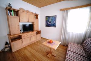 a living room with a tv and a coffee table at Apartment Krabacher in Seefeld in Tirol