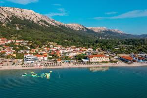 an aerial view of a beach with boats in the water at Hotel Dobrovit in Baška