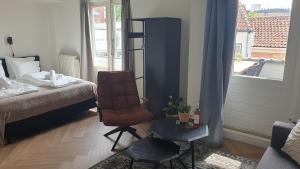Postel nebo postele na pokoji v ubytování Apart Hotel De Grote Kade