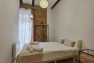 Posteľ alebo postele v izbe v ubytovaní Enjoy Apartment 4 pax at Ruzafa with sunny terrace