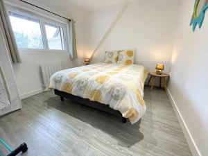 a bedroom with a bed and a window at gîte du moulin du pré in Bavent +13 photos
