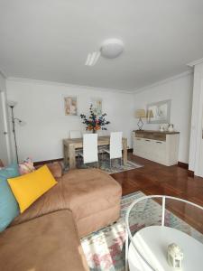 a living room with a couch and a table at La Casuca De Mabel in Revilla de Camargo