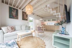 a living room with a couch and a table at SpaceroVa in Nadole