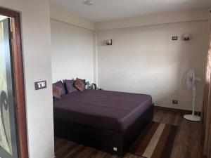 Postel nebo postele na pokoji v ubytování Joyous Rooms